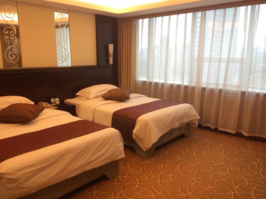 Green Land Hotel Kunming Quarto foto